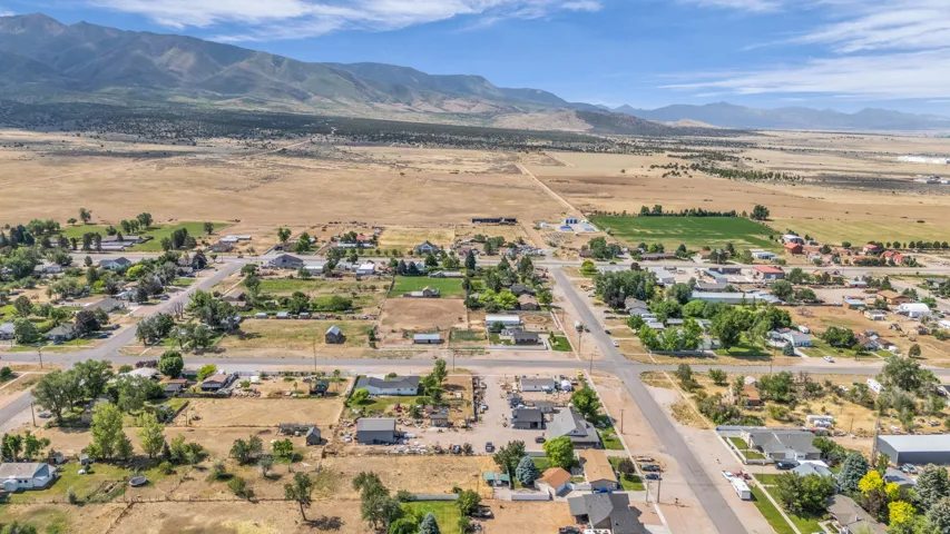 Expansive rural landscape featuring a scattered community of residential properties