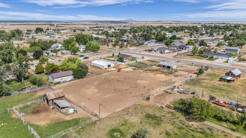 Expansive property with multiple outbuildings, including a barn and a large metal structure