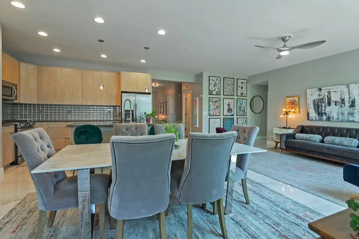 Open-concept living space featuring recessed lighting and a ceiling fan