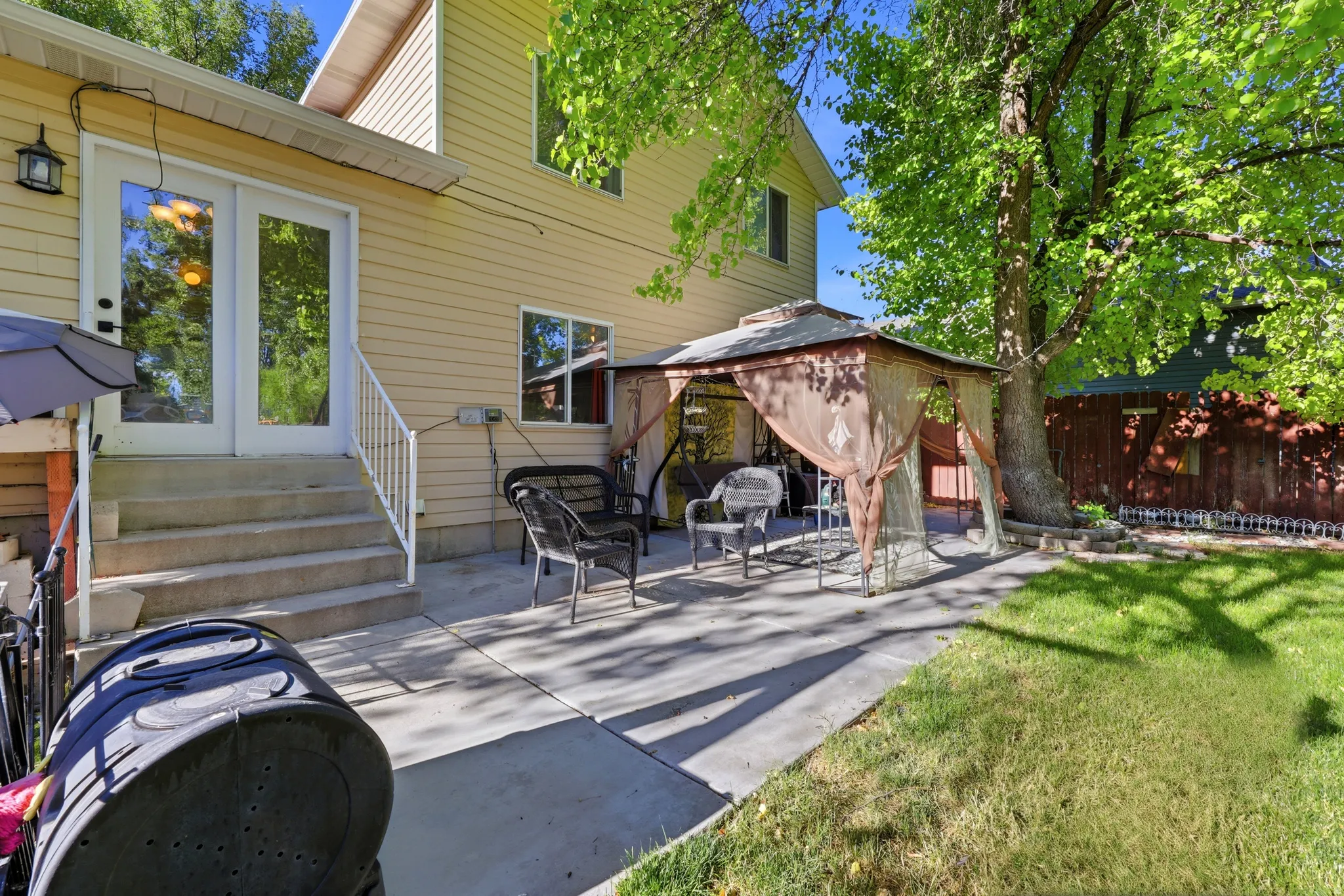 Expansive concrete patio with direct access from double glass pane doors