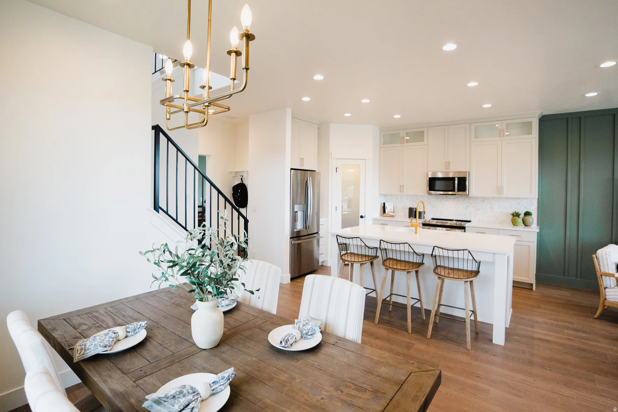 Open-concept living area featuring wood-finish flooring throughout