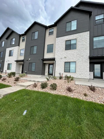 Contemporary multi-level residences featuring a blend of brick, stucco, and horizontal siding