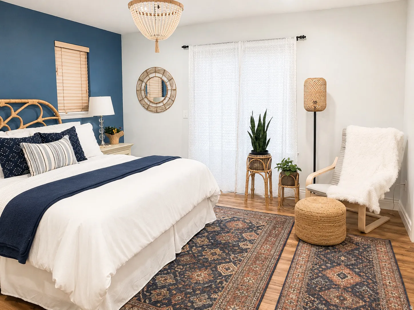 Bedroom featuring wood-finish flooring and a decorative chandelier