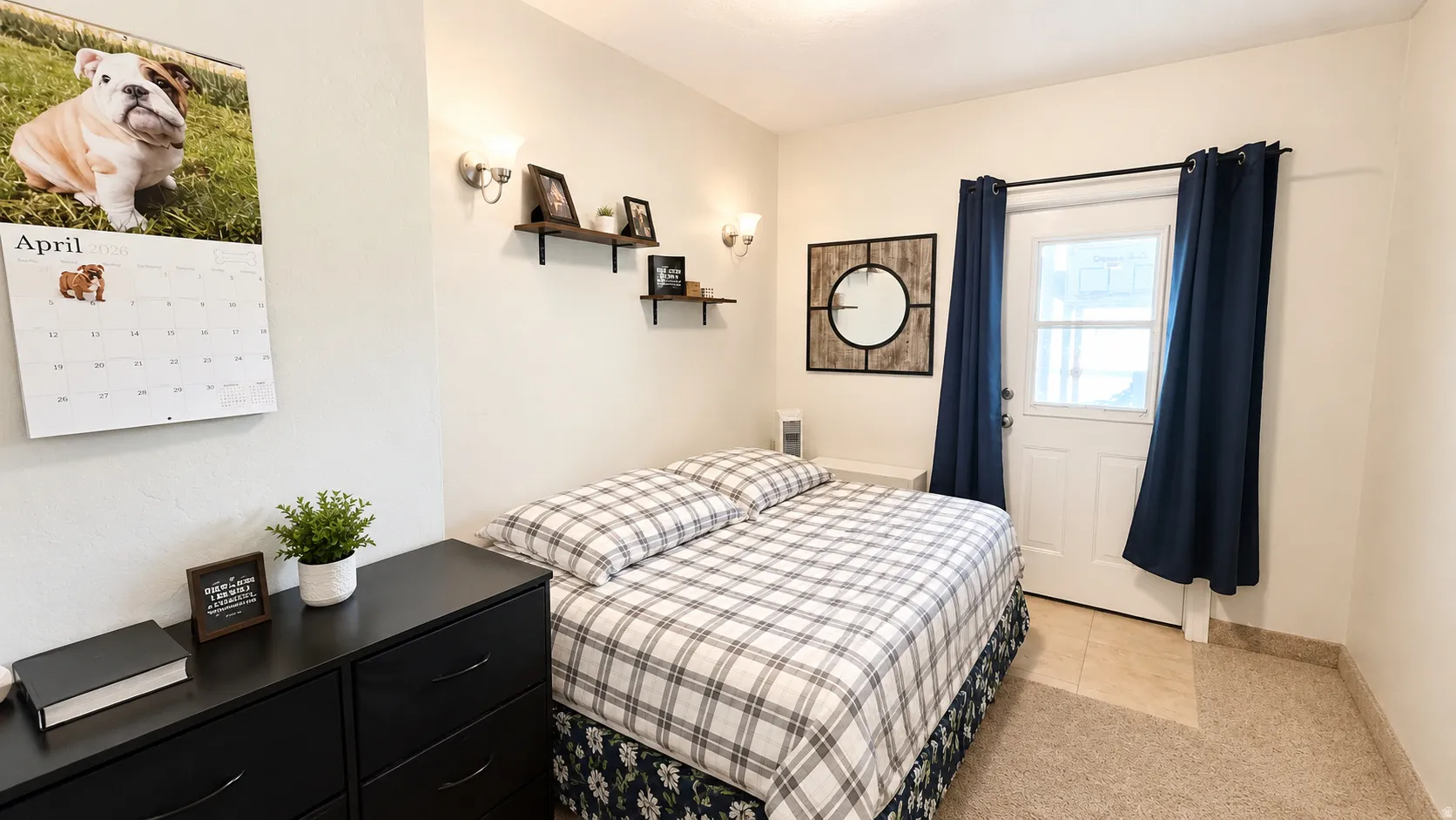 Room featuring an exterior door with glass insert, two wall-mounted sconces, and floating wall shelves