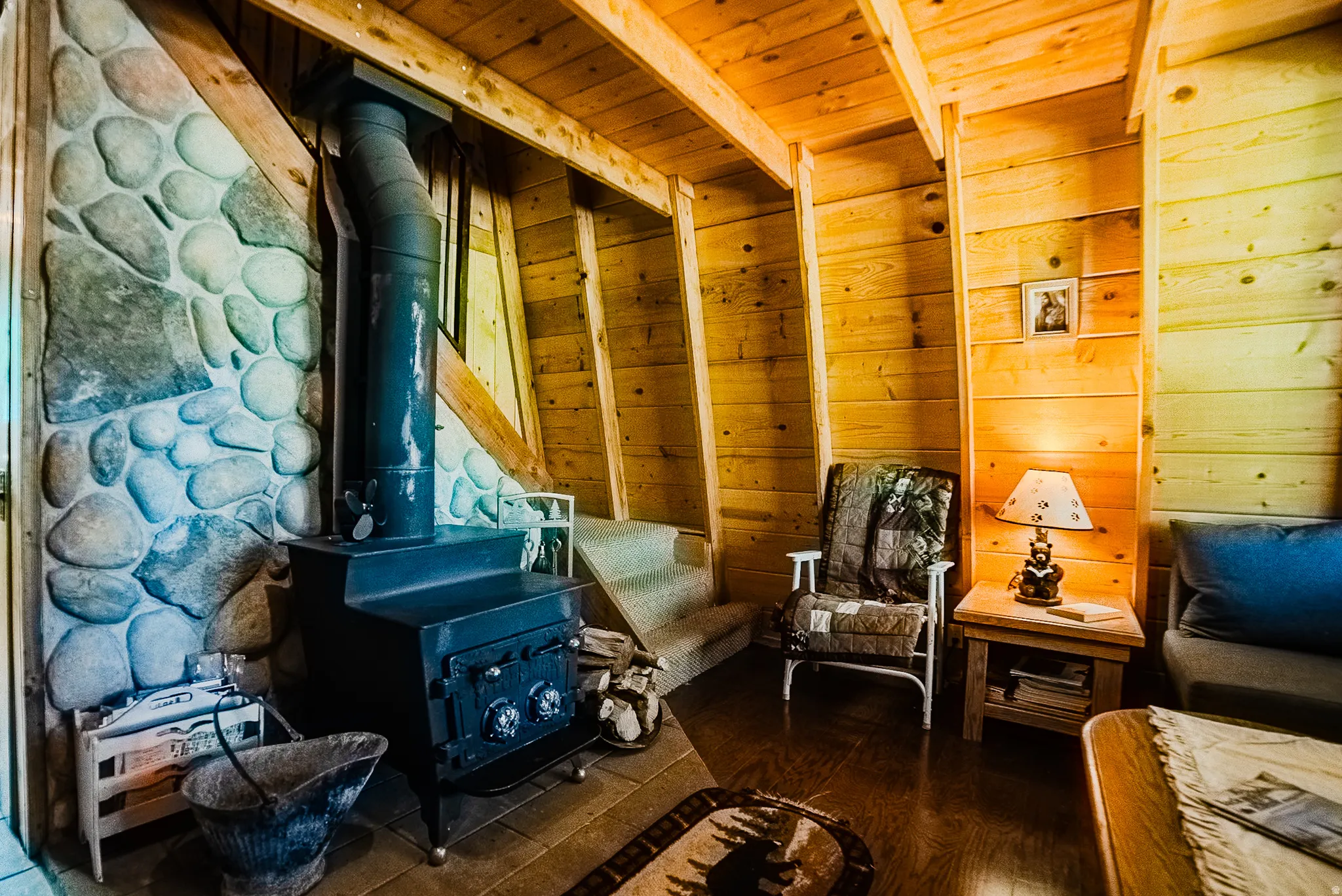 Interior space featuring a substantial wood-burning stove with a stone surround