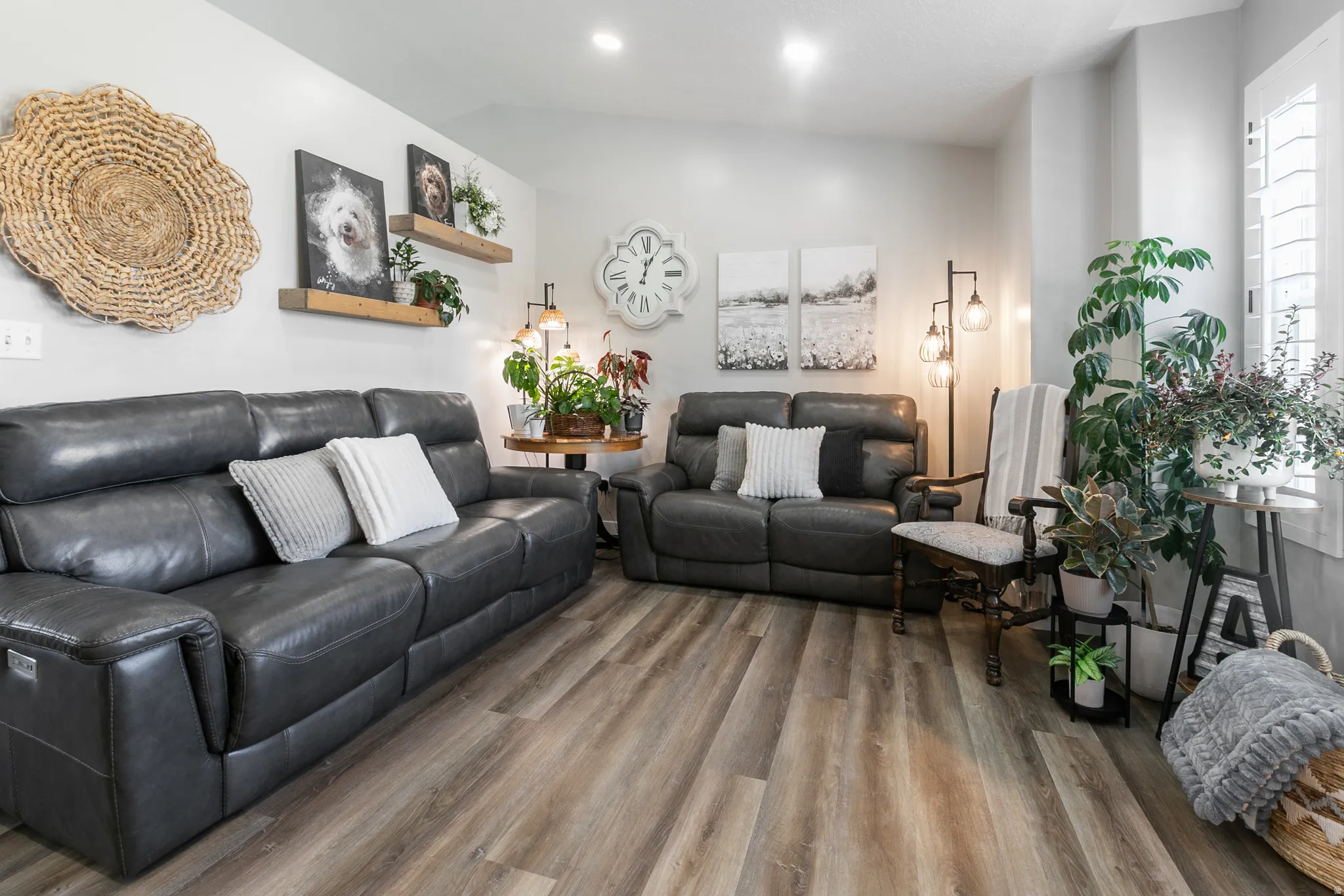 Light-toned walls complement wood-finish flooring in this living area