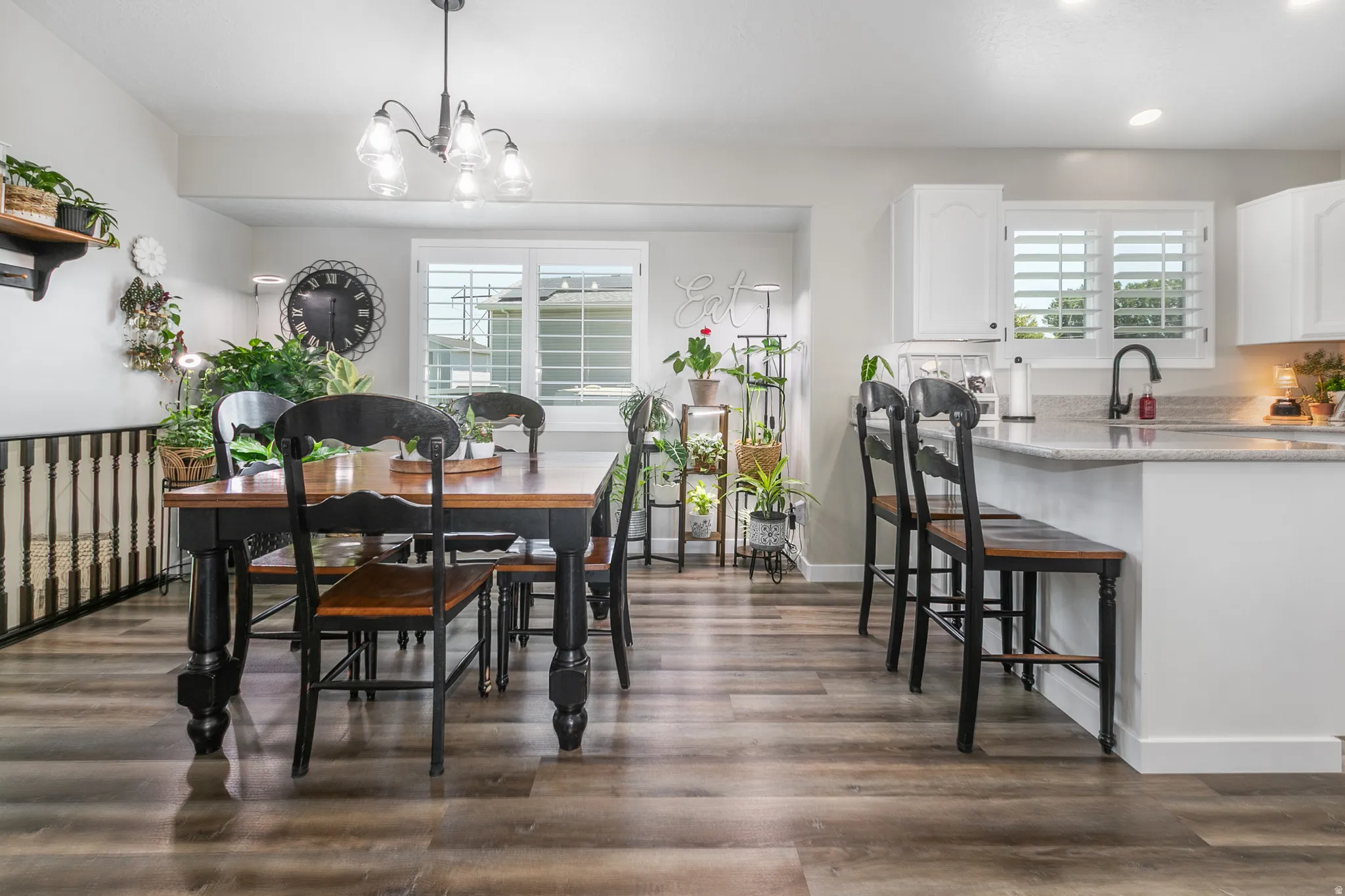 Open-concept living space featuring wood-finish flooring throughout