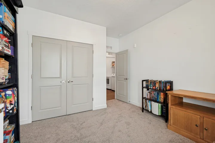Bedroom 2 Neutral-toned carpeting throughout