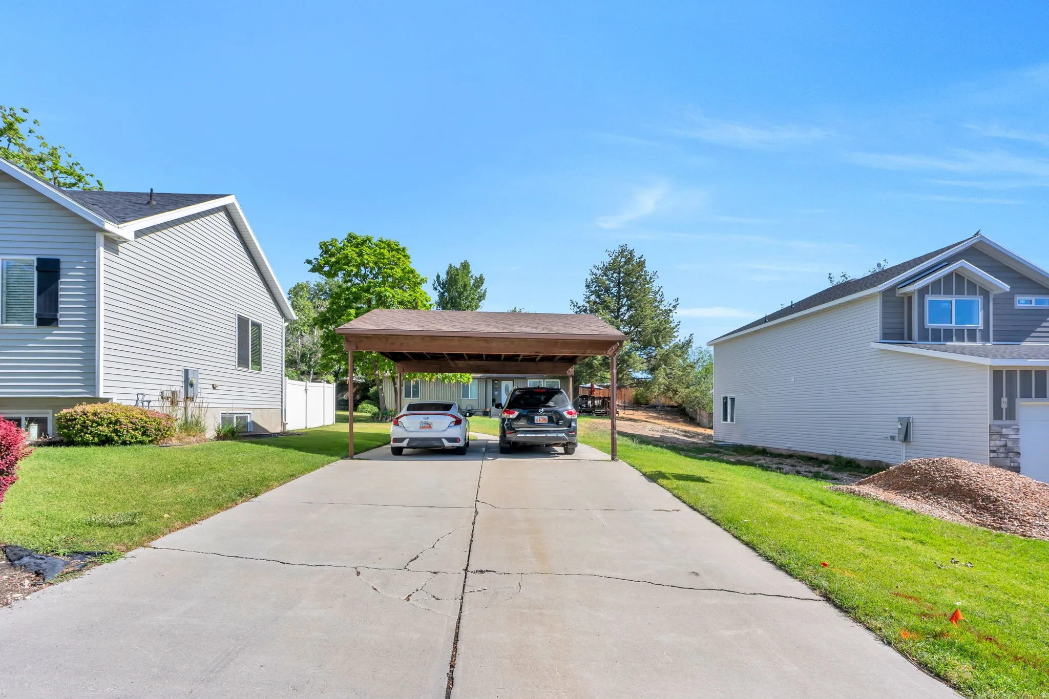 Concrete driveway with a two-car carport