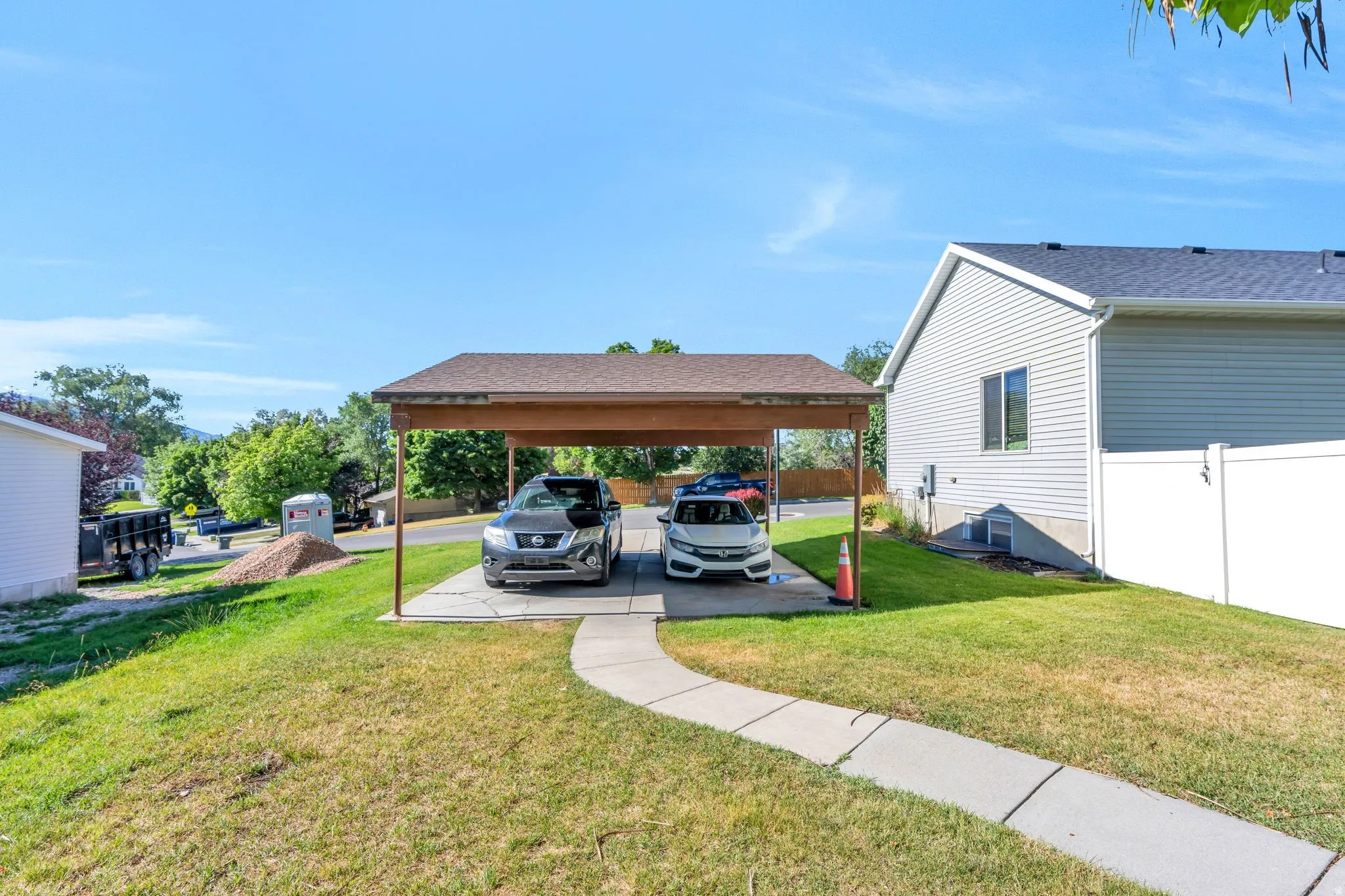 Carport structure providing sheltered parking