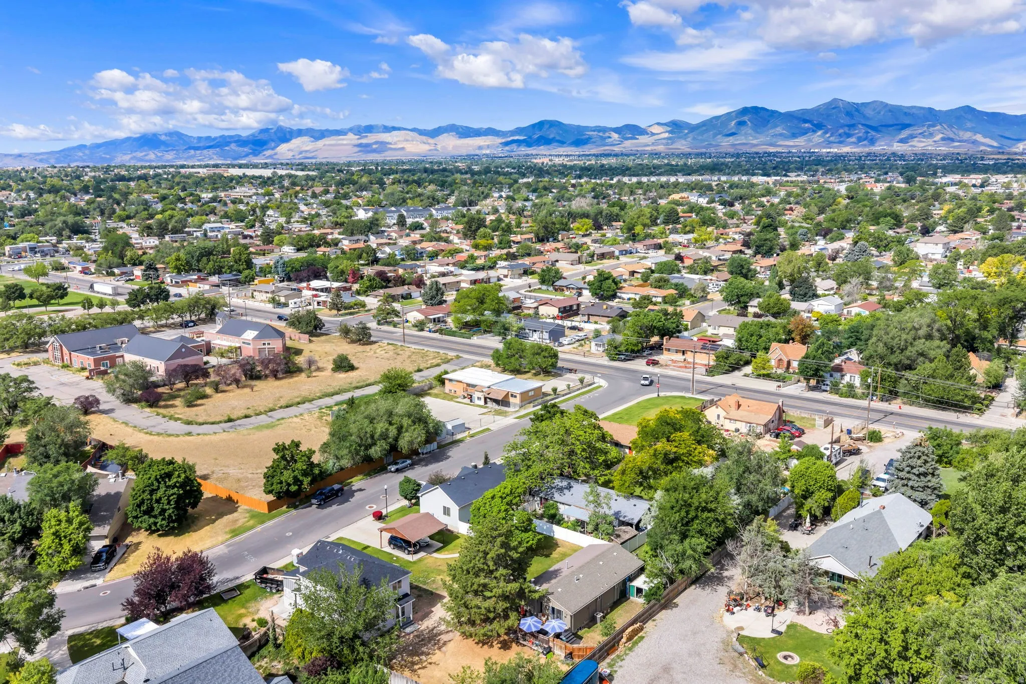 Expansive suburban neighborhood with a backdrop of distant mountains