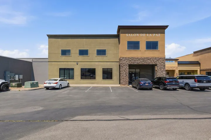 Commercial building featuring stucco and stone veneer facade