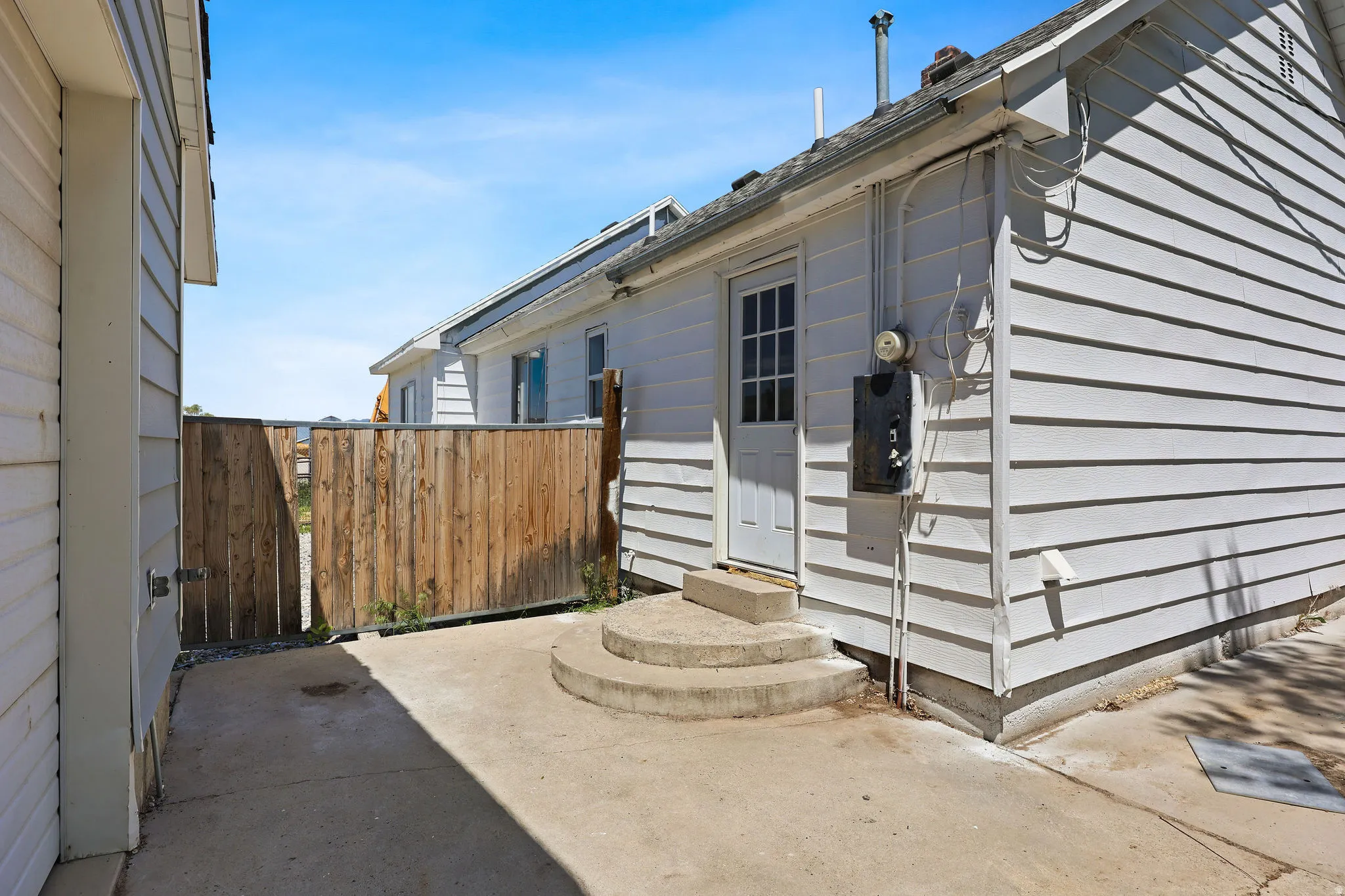 Exterior siding in a horizontal white panel finish