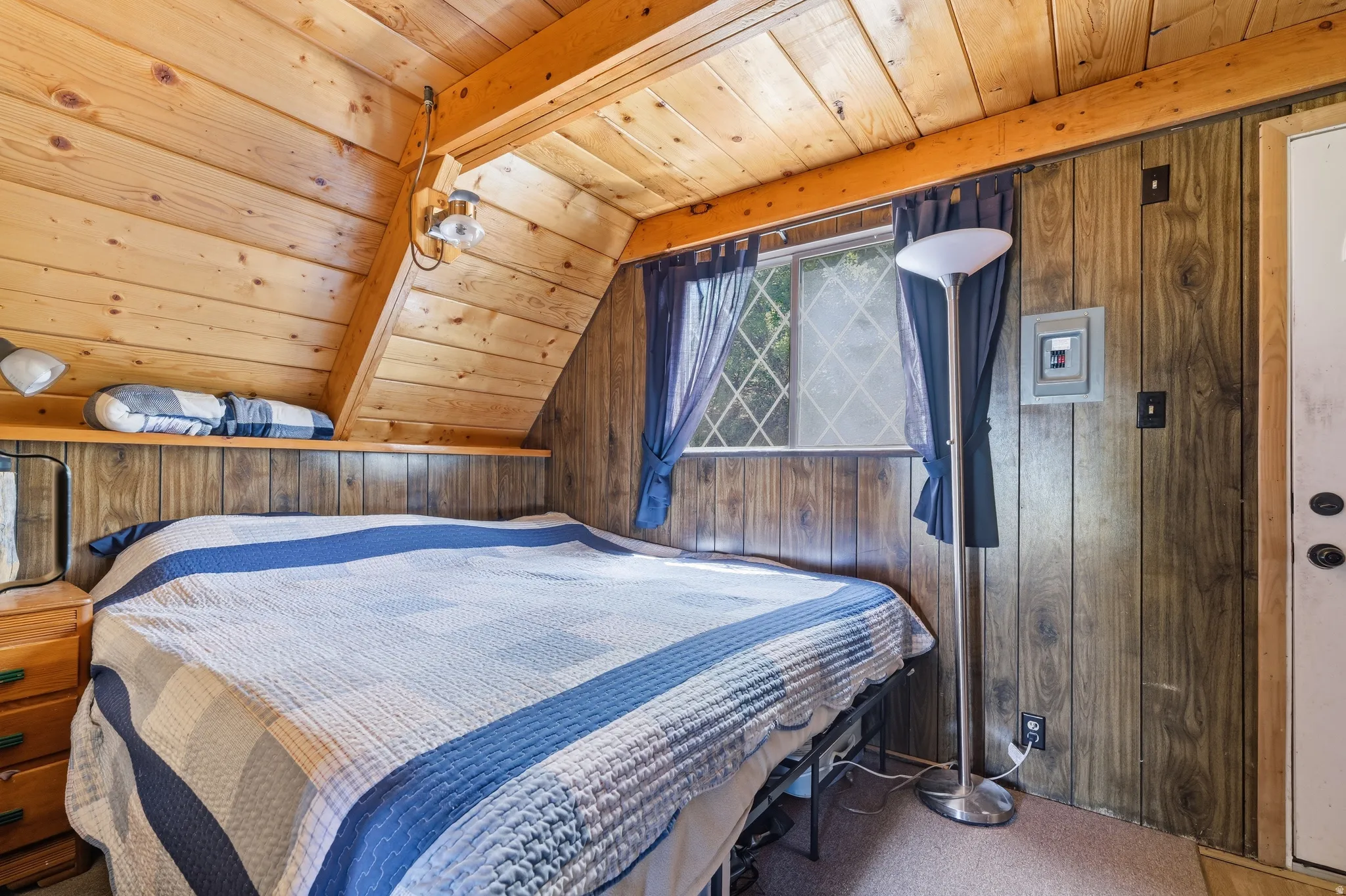 Vaulted wood-paneled ceilings with exposed beams