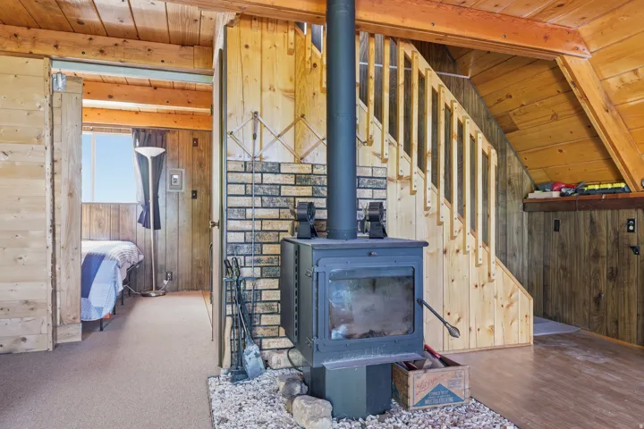 Wood-burning stove with a brick-finish backdrop
