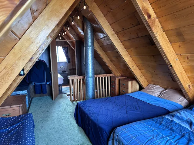 Vaulted wood-paneled ceilings with exposed beams