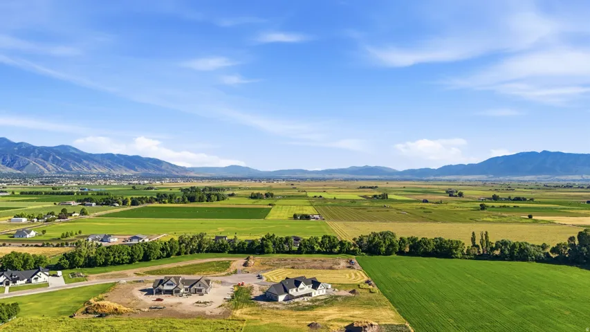 Expansive valley setting with agricultural land and distant mountains