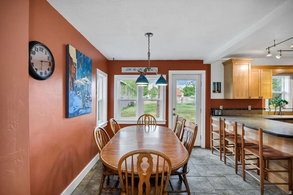 Dining area with tile flooring and direct outdoor access