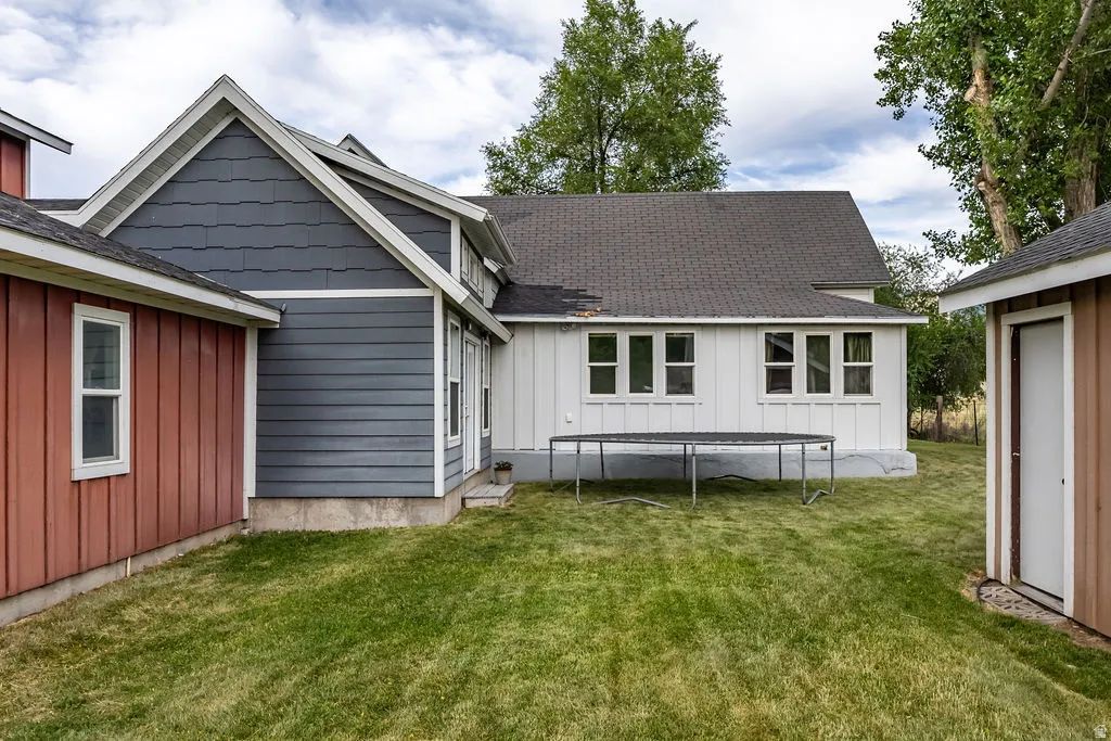Exterior featuring a combination of horizontal siding, vertical siding, and shingle siding