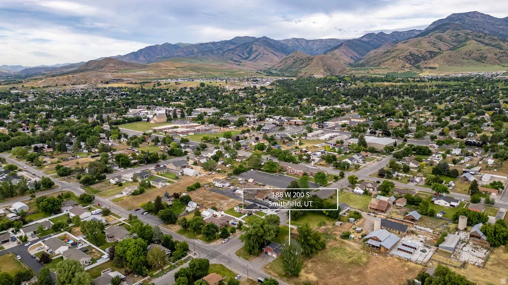 Expansive Smithfield, UT setting featuring residential properties, mature tree coverage, and mountain scenery