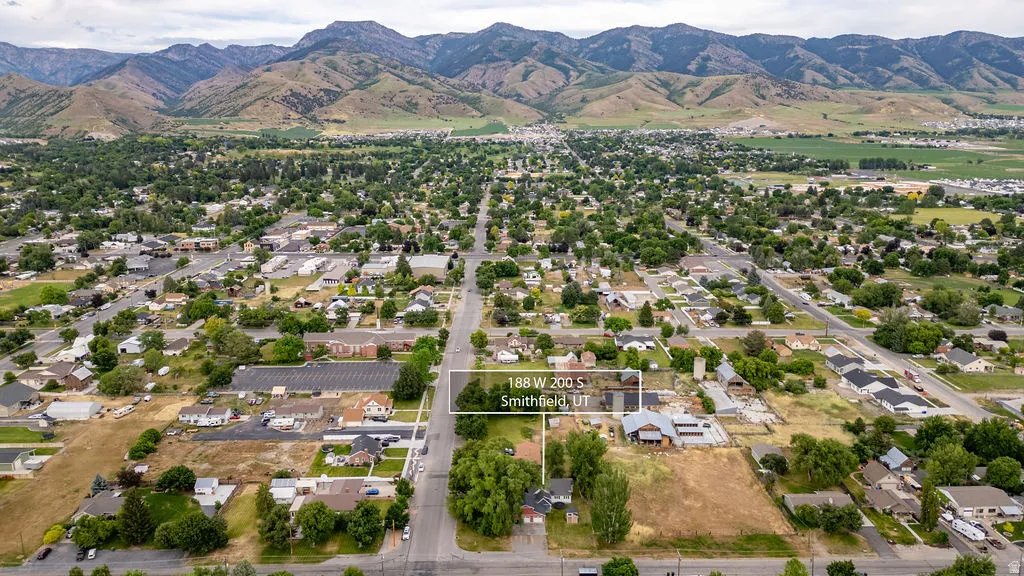 Aerial perspective showcasing a residential neighborhood with established street grids and mature tree canopies