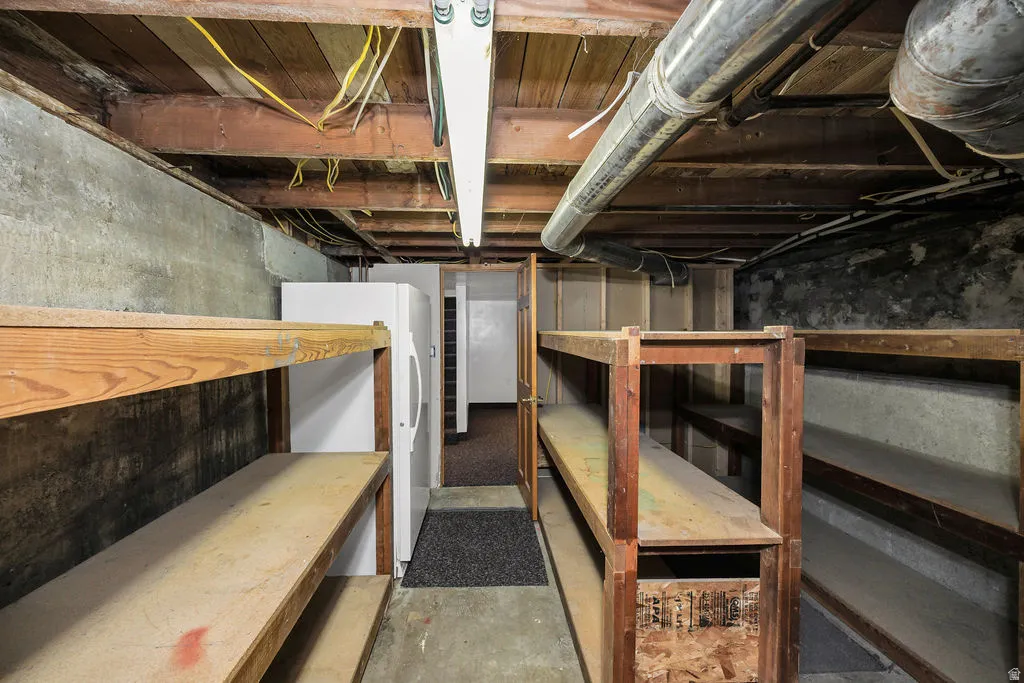 Concrete foundation walls with exposed wood ceiling joists