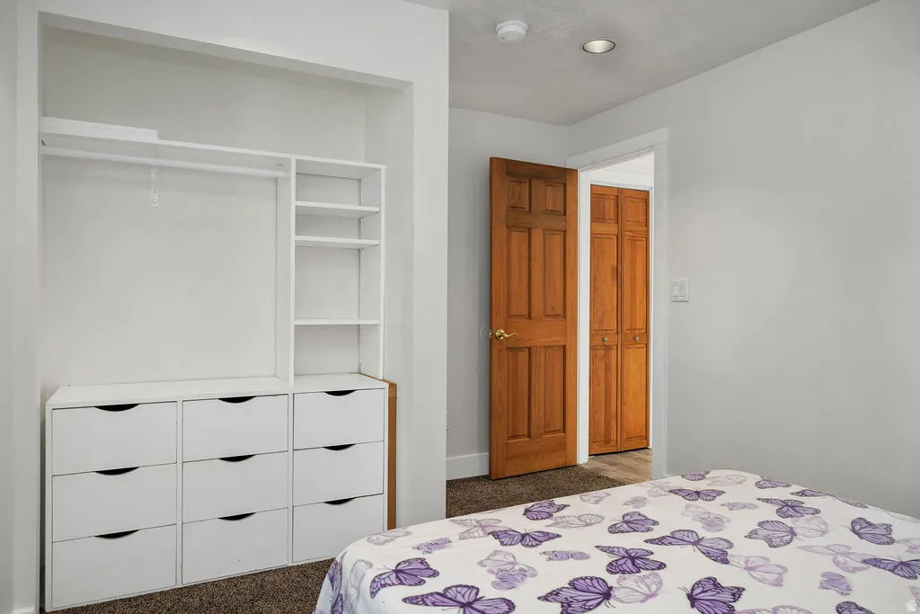 Integrated closet system featuring nine drawers, shelving, and a hanging rod