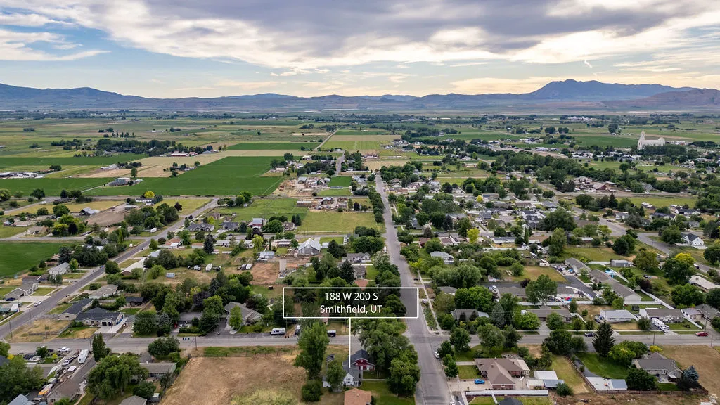 Expansive aerial perspective showcasing a residential area amidst agricultural fields