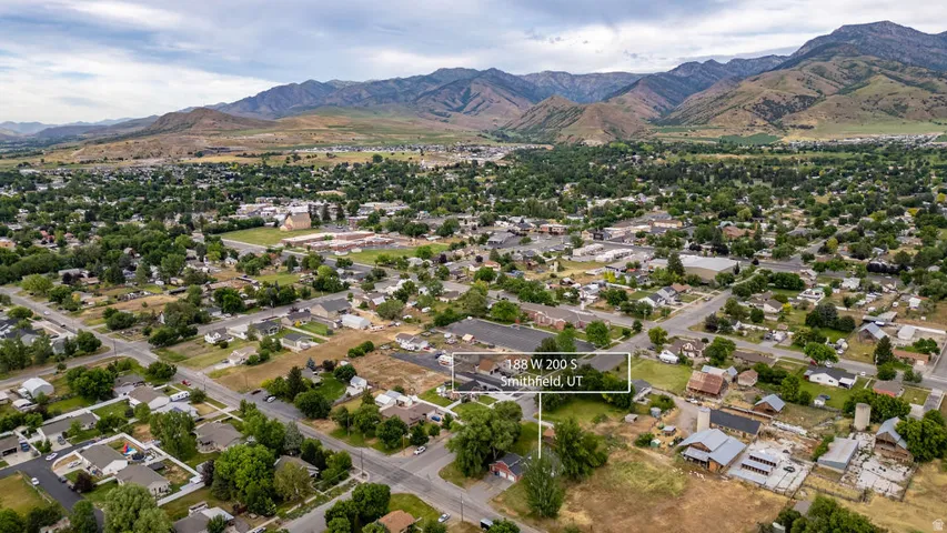 Expansive Smithfield, UT setting featuring residential properties, mature tree coverage, and mountain scenery