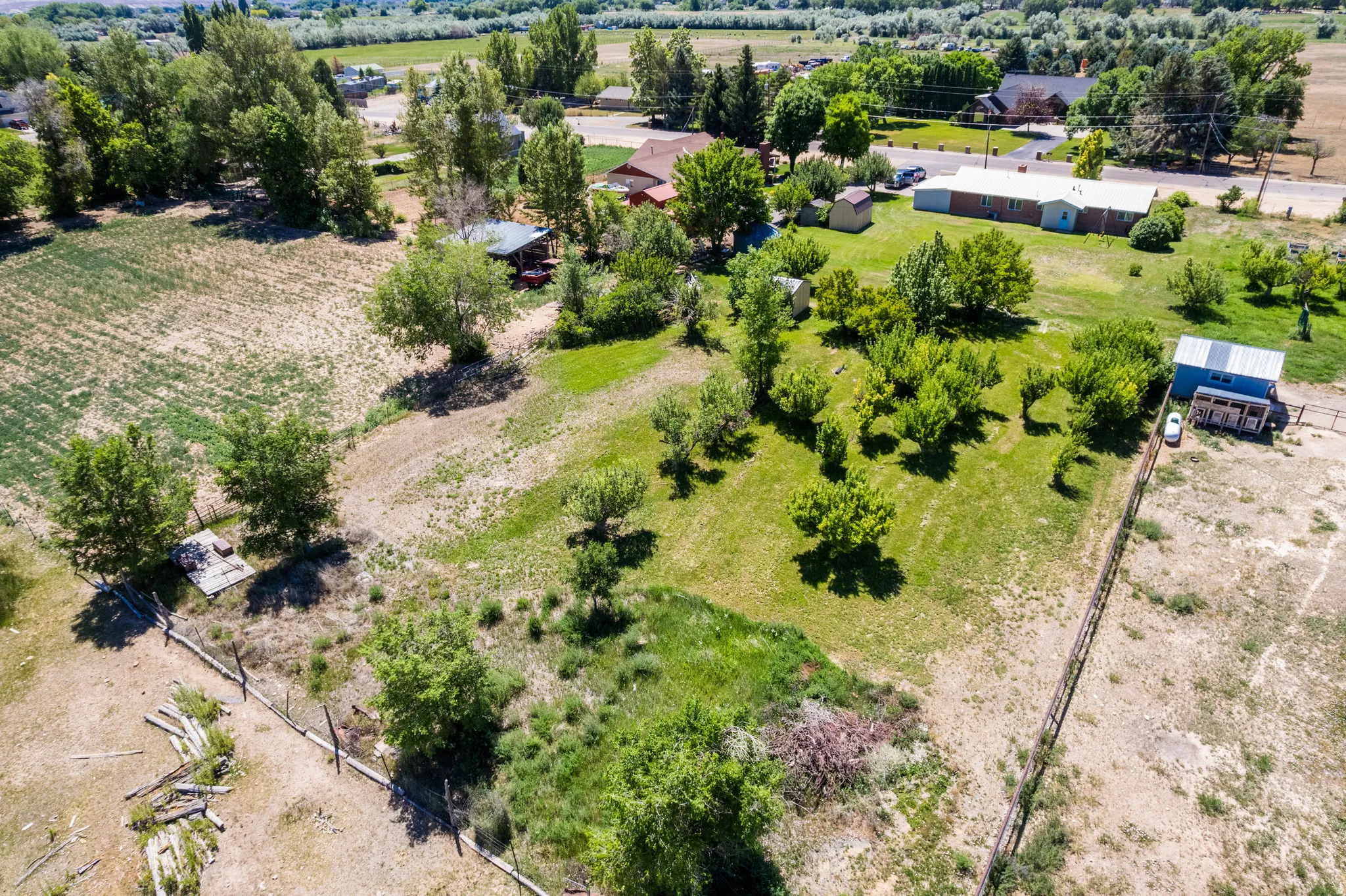 Expansive property featuring a mix of cultivated and natural landscapes