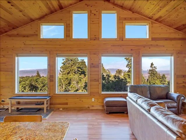 Vaulted wood-paneled ceilings with multiple upper windows