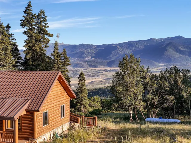 Log cabin exterior with ski resort views