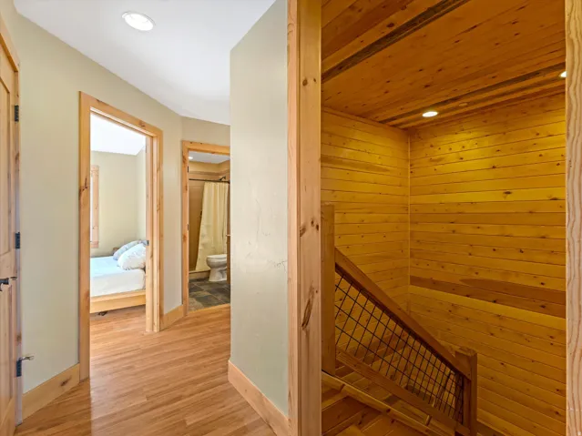 Wood-finish flooring extending through the hallway