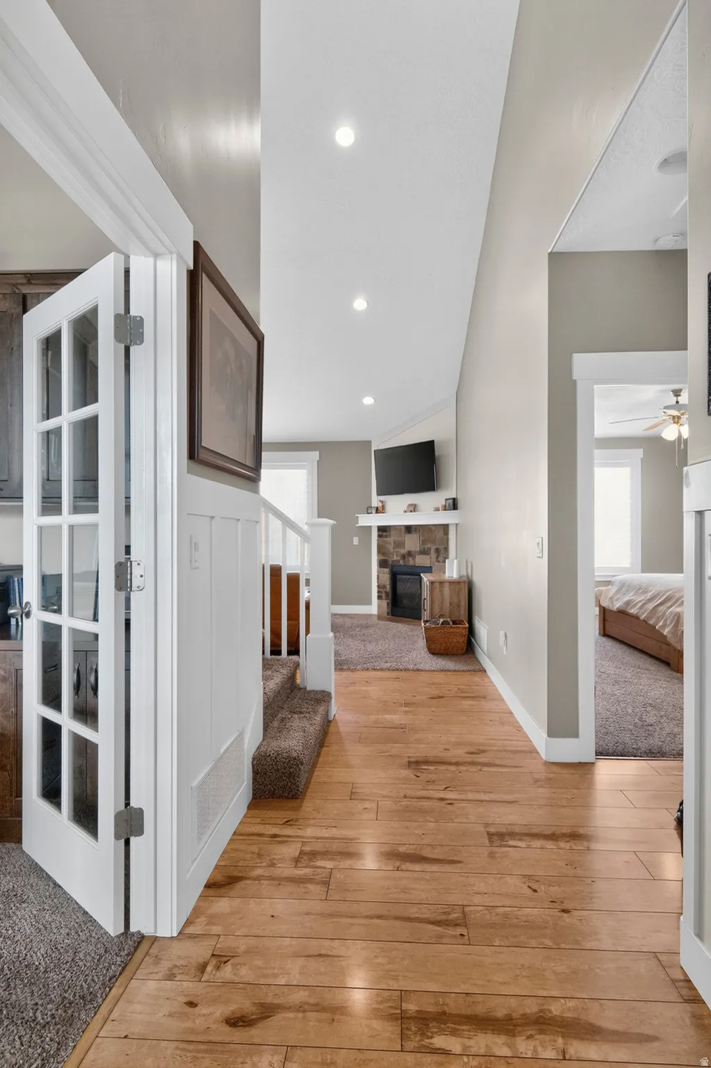 Hallway featuring wood-finish flooring and recessed lighting