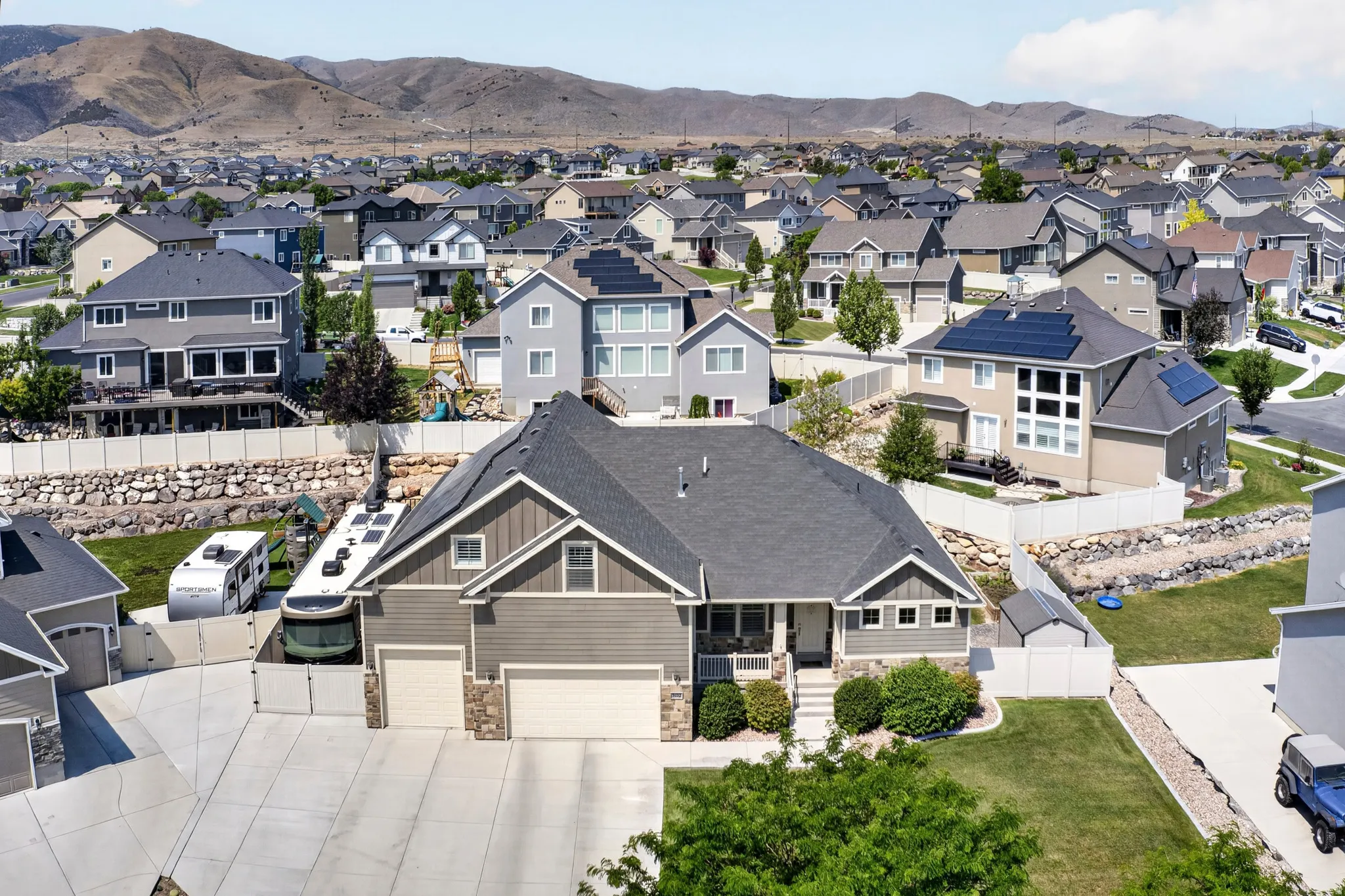 Two-story residence featuring a two-car garage and a paved driveway