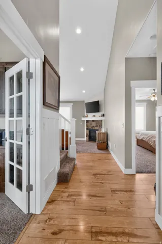 Hallway featuring wood-finish flooring and recessed lighting