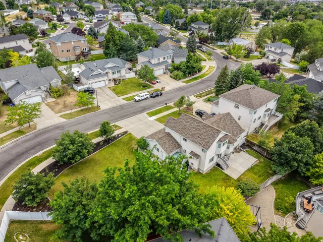Aerial view of a residential neighborhood with paved streets and sidewalks
