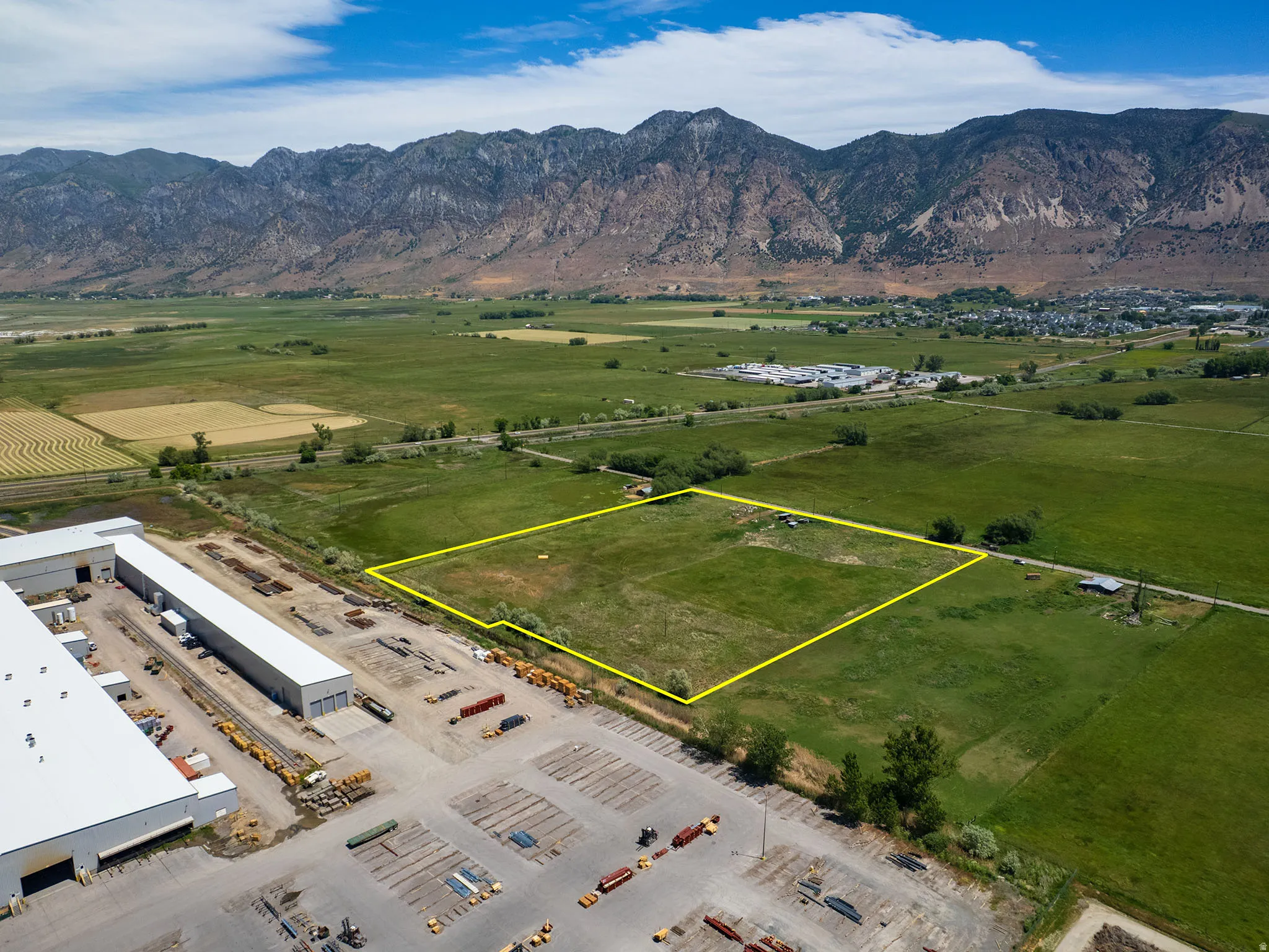 Expansive green space featuring three  parcels marked in yellow boundary line including Parcel # 03-077-0015, and adjacent parcel available for sale MLS 2163865 (Parcel #'s 03-077-0011 and 03-077-0012) for a footprint of 8.94 Acres Available.