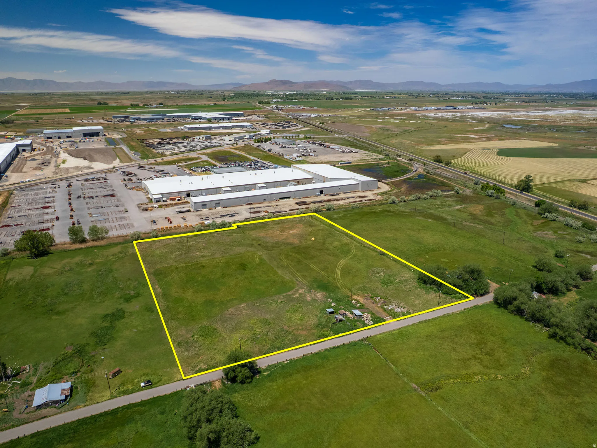 Expansive undeveloped land parcel with marked boundaries. Expansive green space featuring three parcels including Parcel # 03-077-0015, and adjacent parcels available for sale MLS# 2163865 (Parcel #'s 03-077-0011 and 03-077-0012) for a footprint of 8.94 A