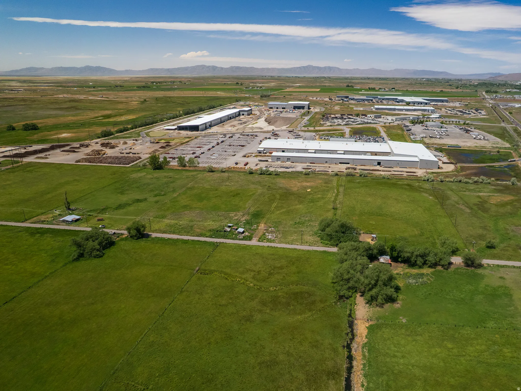 Expansive industrial complex featuring multiple large buildings and extensive outdoor storage areas