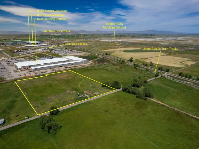 Expansive land parcel featuring direct road frontage and a verdant, undeveloped landscape outlined in yellow, featuring a predominantly green, grassy surface including three parcels, Parcel # 03-077-0015, and adjacent parcel available for sale MLS 2163865