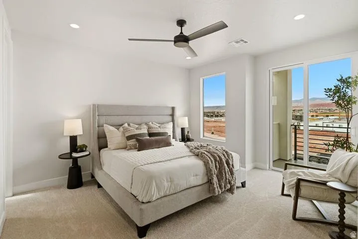 Bedroom featuring a sliding glass door to a private balcony, a large window, a ceiling fan, and recessed lighting