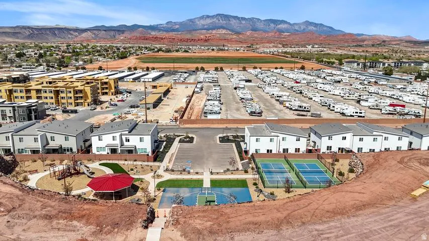 Community amenities featuring a playground, red gazebo, two tennis courts, and a multi-sport court