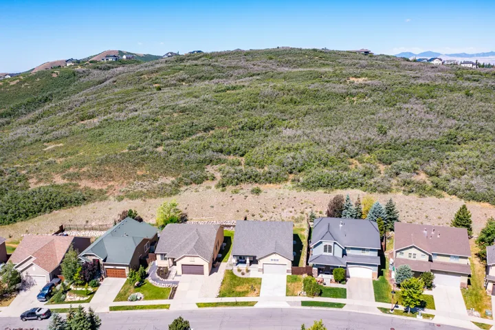 Expansive natural hillside terrain bordering residential properties
