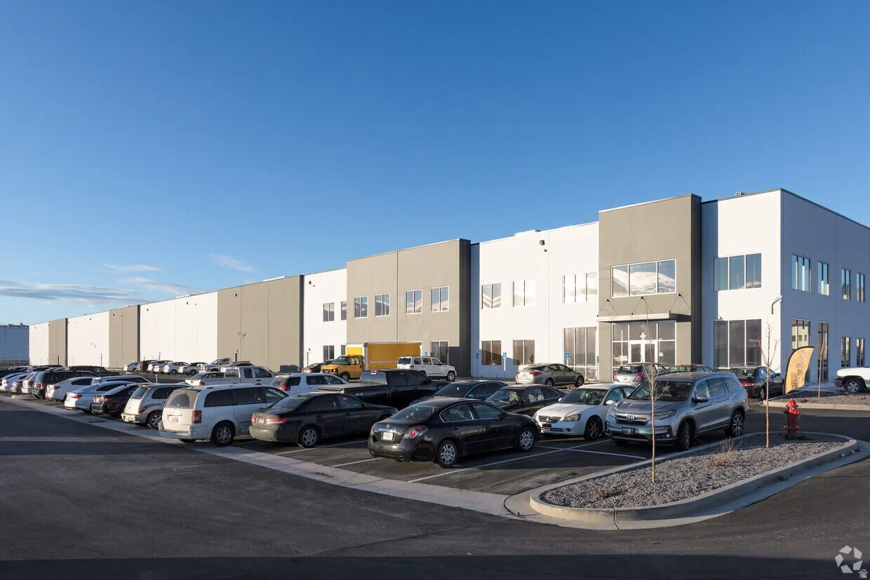 Modern commercial building featuring a gray and white exterior