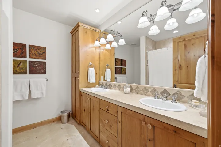 Dual vanity with integrated sinks and chrome fixtures