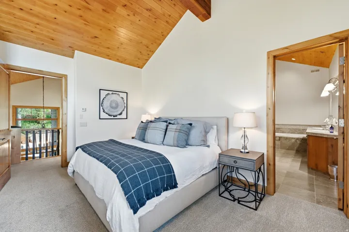 Vaulted wood-finish ceiling with exposed beams