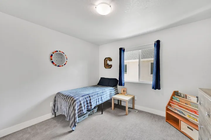 Light gray carpet flooring and white painted walls