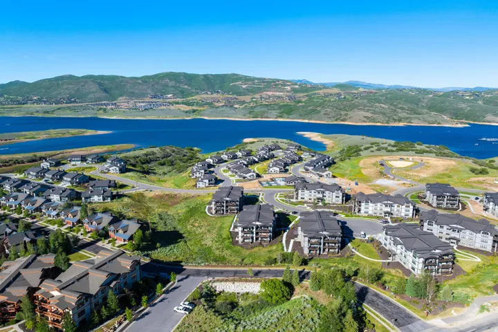 Aerial perspective showcasing a residential community with single-family homes and multi-story buildings