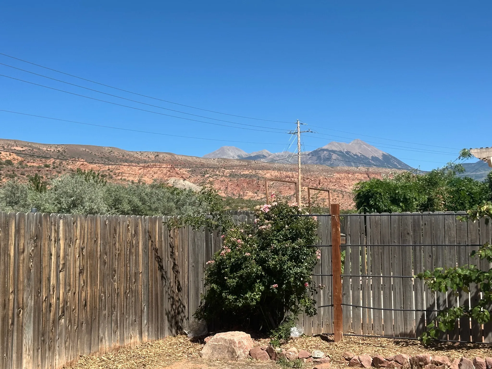 Mountain backdrop featuring peaks and red rock formations